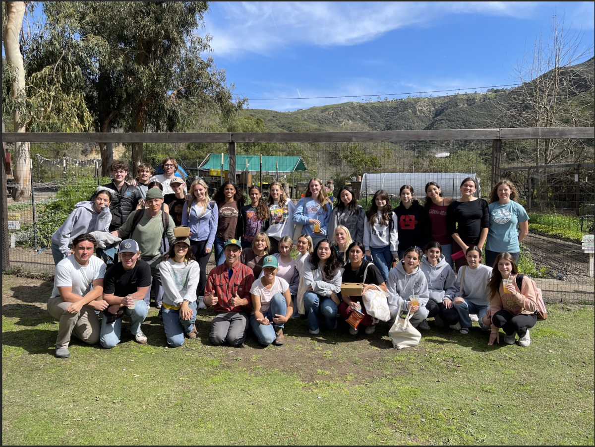 LBHS Marine Ecology, FLOW, Journalism, and Video Production students gather for a photo smiling in harmony. The students conducted various projects depending on their purpose for being on the field trip such as purifying water for example. 